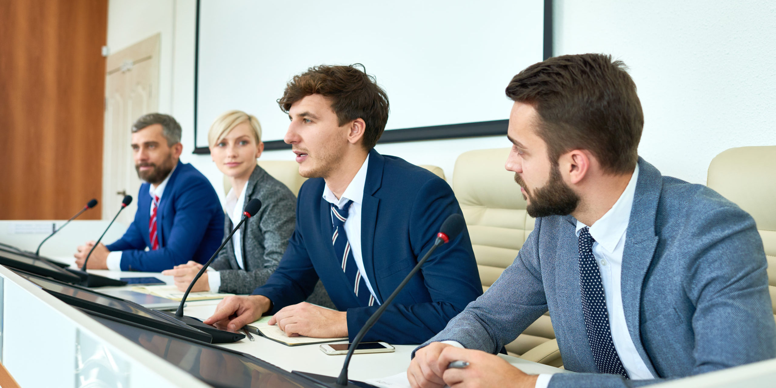 Portrait,Of,Several,Business,People,Sitting,In,Row,Participating,In