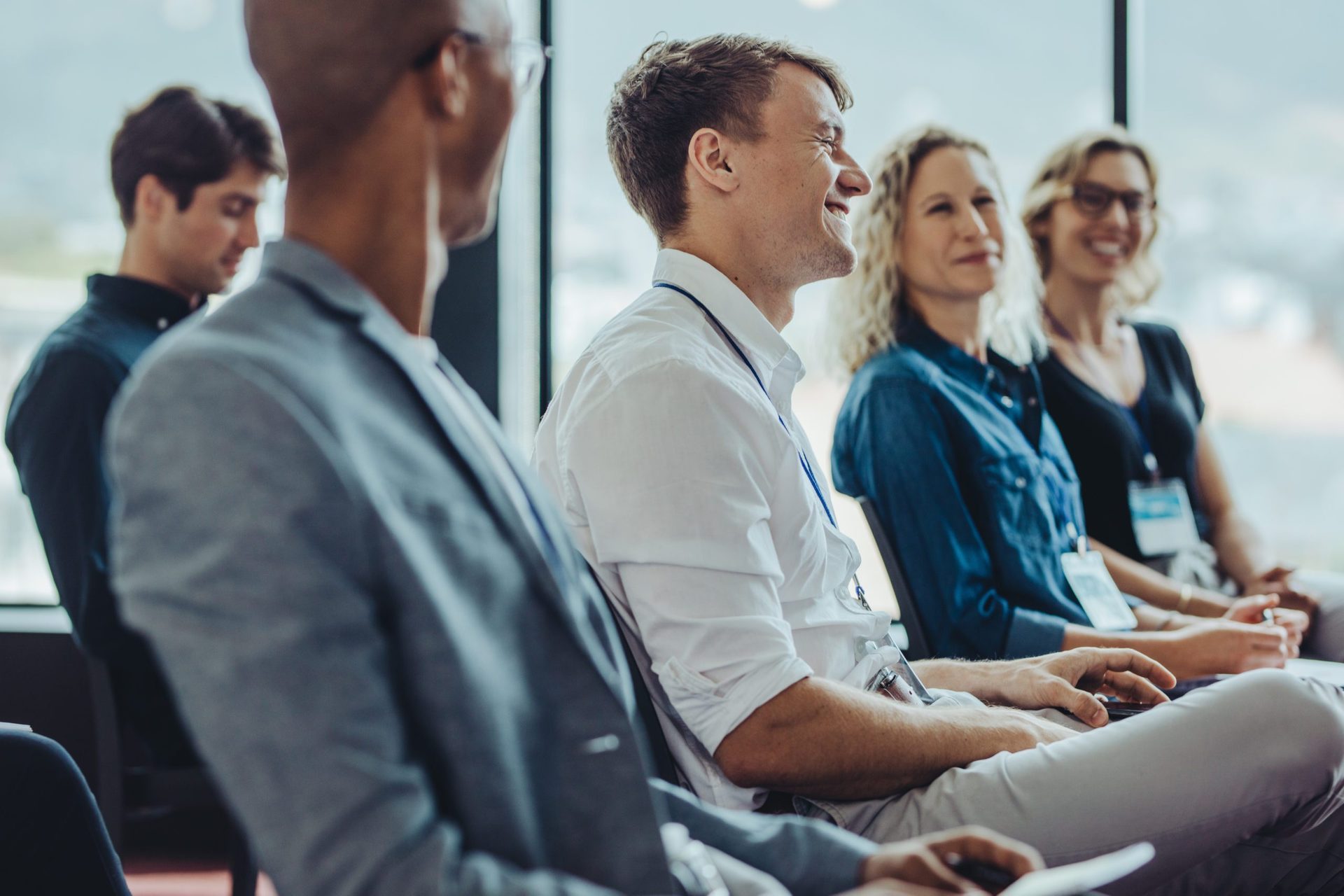 Group of multi-ethnic businesspeople in a seminar Businessmen and businesswomen sitting in audience. Group of multi-ethnic businesspeople sitting in a seminar.